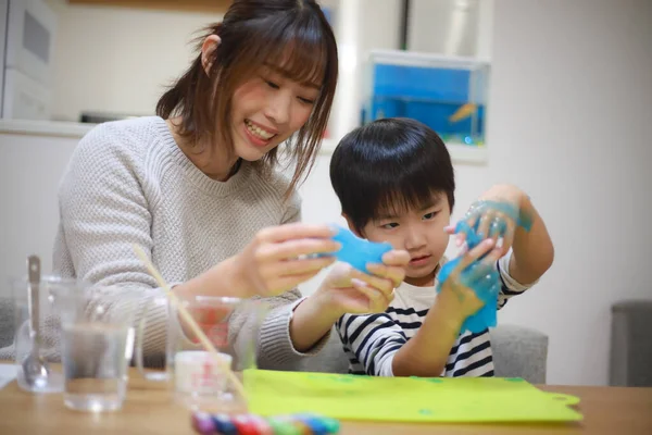 Parent and child making slime 