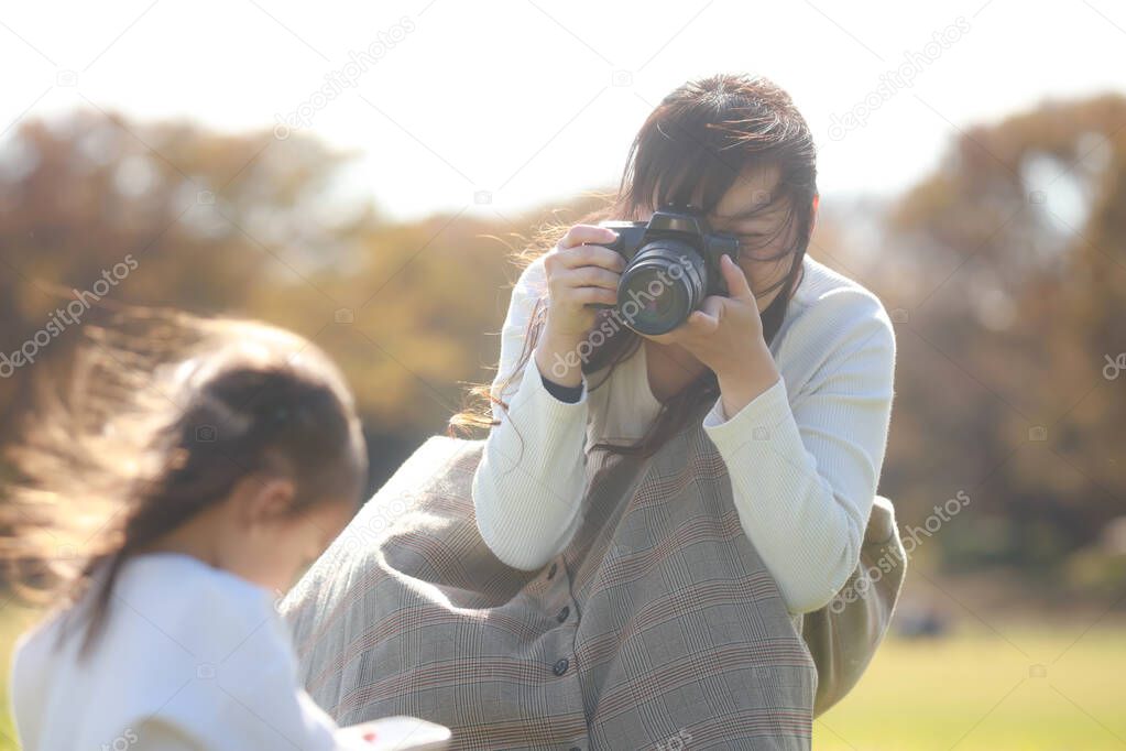 Mother taking pictures of children 