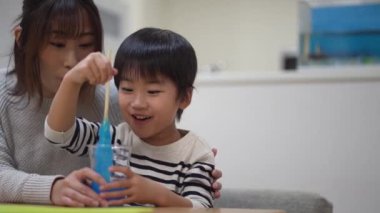 Parent and child making slime 