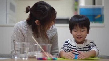 Parent and child making slime 