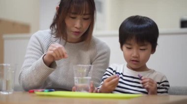 Parent and child making slime 
