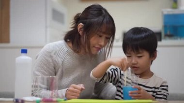 Parent and child making slime 