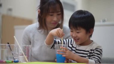 Parent and child making slime 