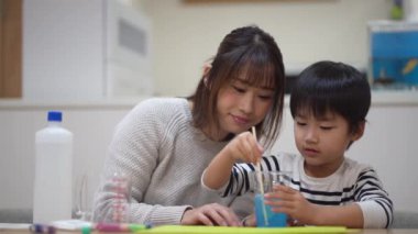 Parent and child making slime 