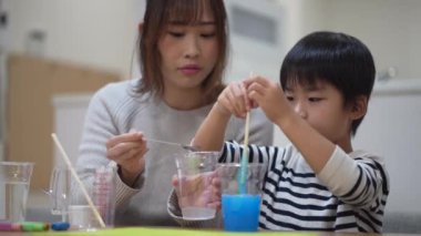Parent and child making slime 