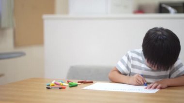 Image of a boy drawing