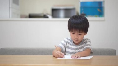 Image of a boy drawing 