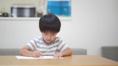 Image of a boy drawing 