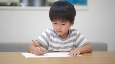 Image of a boy drawing 