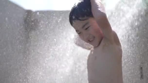 Boy Frolicking Shower — ストック動画