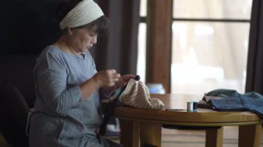 Woman handcrafting a bag 