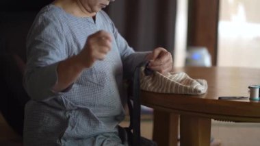 Woman handcrafting a bag 