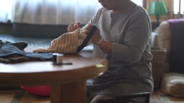Woman handcrafting a bag 