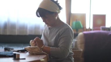 Woman handcrafting a bag 