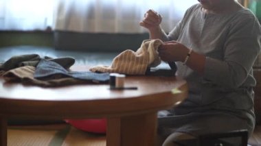 Woman handcrafting a bag 