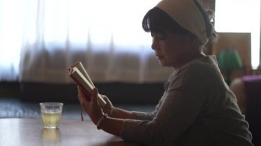 Female reading at home 