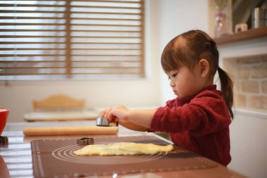 Image of a girl making sweets 