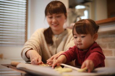 Parents and children making sweets 