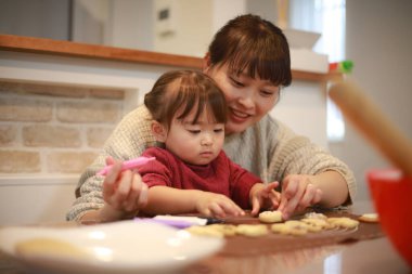 Parents and children making sweets 