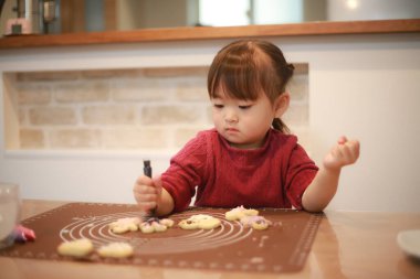 Image of a girl making sweets 