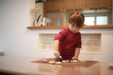 Image of a girl making sweets 