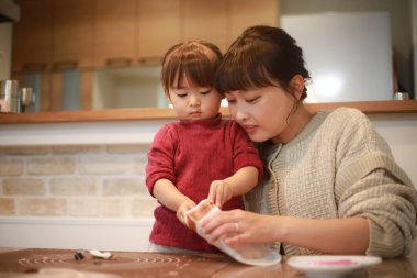 Parents and children making sweets 