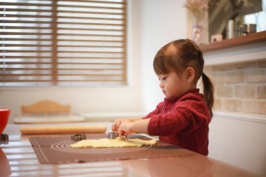 Image of a girl making sweets 