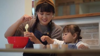 Parents and children making sweets 