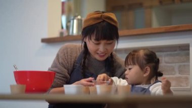 Parents and children making sweets 
