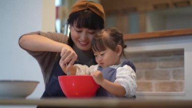Parents and children making sweets 