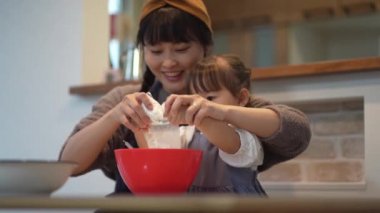Parents and children making sweets 