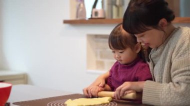Parents and children making sweets 