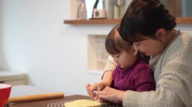 Parents and children making sweets 