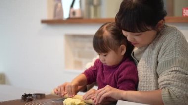 Parents and children making sweets 