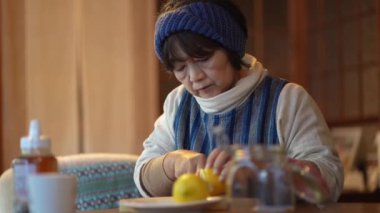 A woman making honey pickles of lemon 