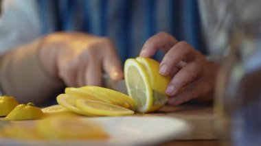 A woman making honey pickles of lemon 