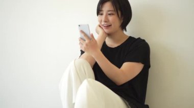 Female operating a smartphone 