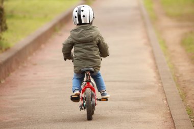 Image of a boy riding a bicycle 