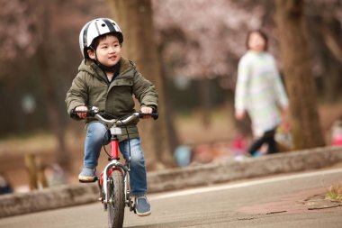 Image of a boy riding a bicycle 