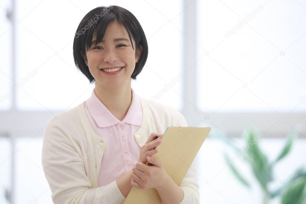 Image of a caregiver with a binder 