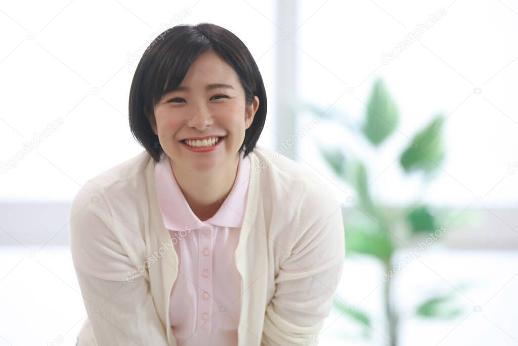 Image of a smiling female caregiver 