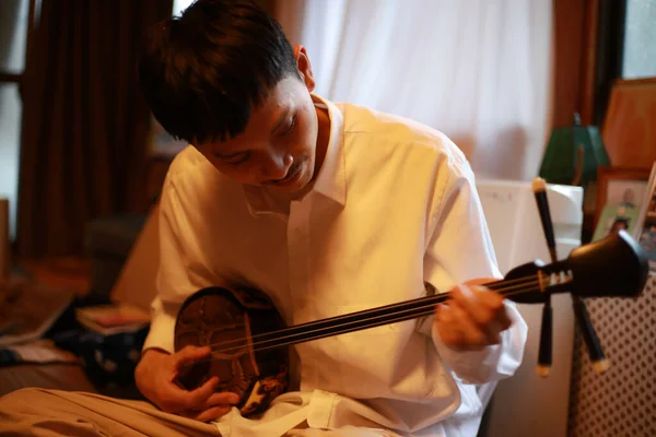 Young Man Playing Musical Instrumet — Stock Photo, Image