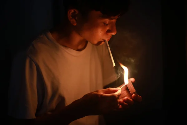 Young Asian Man Lighting Cigarette — Stock Photo, Image