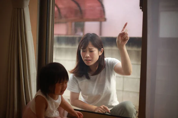 Young Asian Mother Looking Window Little Daughter Home — Stock Photo, Image