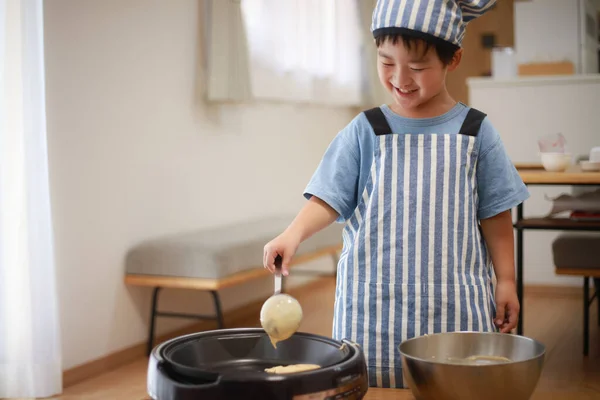 Little Japanese Boy Cooking Pancakes Kitchen Chef Hat His Head — Stock Photo, Image