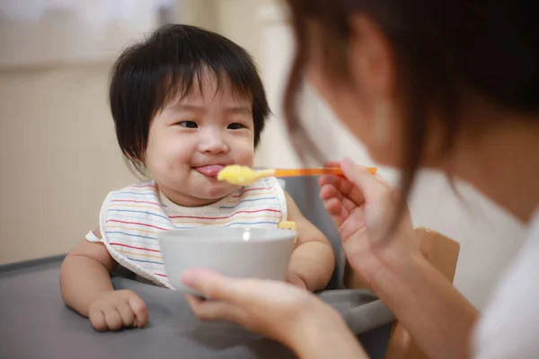 Happy Mother Feeding Baby — Stock Photo, Image