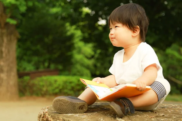 Cute Asian Little Boy Reading Park — Stock Photo, Image