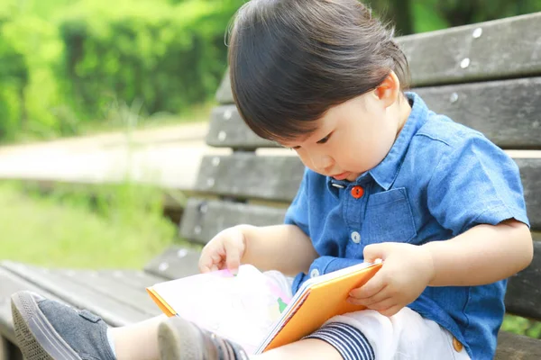 Asian Little Boy Looking Book Park Outdoors — Stock Photo, Image