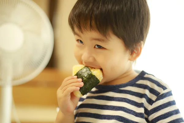 Asian Little Boy Eating Onigiri Home — Stock Photo, Image