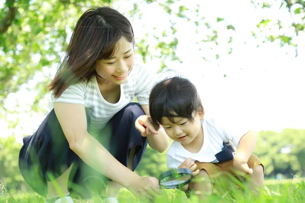 Young Asian Mother Her Child Park Magnifier Stock Photo